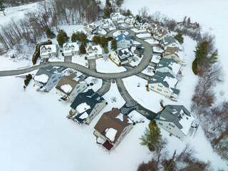 Wall Mural - aerial view of residential community in winter after snow