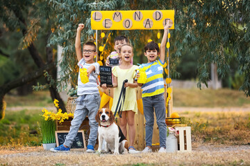 Wall Mural - Cute children selling lemonade in park