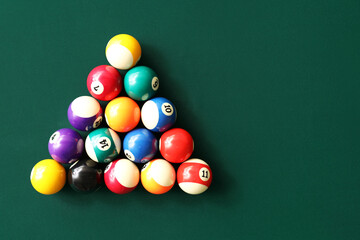 Wall Mural - Different billiard balls on table