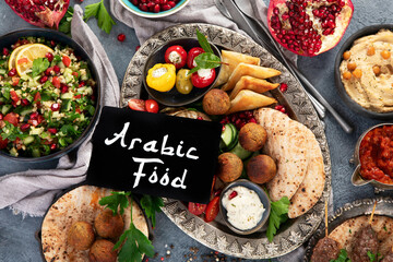 Wall Mural - Arabic food assortment on dark background.