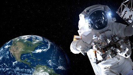 Wall Mural - Astronaut spaceman do spacewalk while working for spaceflight mission at space station . Astronaut wear full spacesuit for operation . Elements of this image furnished by NASA space astronaut photos .