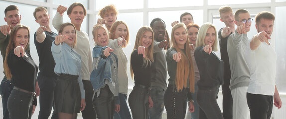 Wall Mural - group of young like-minded people pointing at you