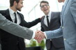 © ASDF - welcome handshake of business people in the office