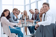 © ASDF - successful business team sitting at the table in the conference room