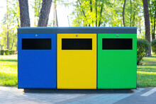 Color Coded Recycling Bins In The Public Park