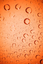 Bubble Water On Red Glass Background.