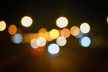 Canvas Print - A view of yellow and blue blurry bokeh lights as a background