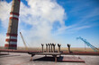 GRES-1 thermal power station roof. Smoke stack, chimneys and construction cranes. blue sky with white cloud.  Ekibastuz, Pavlodar region, Kazakhstan.