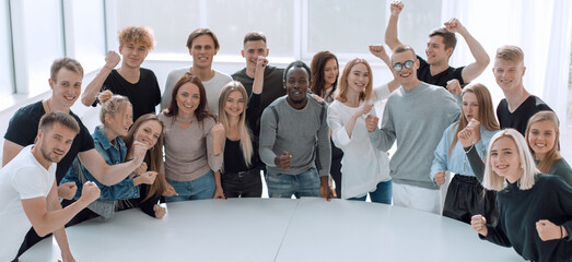 Wall Mural - diverse young people standing near a round table