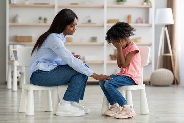 Wall Mural - Distressed black kid crying at psychotherapy session