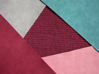 Wall Mural -  red, burgundy, blue, gray geometric shapes as background, knitting middle