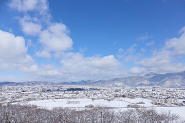 2月（冬） 降雪後の松本の街並みと北アルプス 弘法山古墳（弘法山の山頂）より 長野県松本市