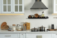 Countertop With Different Cooking Utensils In Kitchen