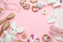 Frame Of Baby Clothes And Accessories On Light Pink Background, Flat Lay. Space For Text