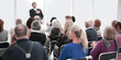 © ASDF - Audience of adult people listen to the speech of the lecturer