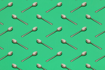 Wall Mural - pattern with spoons on green surface