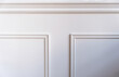 Classic wainscot wood decoration detail. Retro white wall wooden panel, close up view.