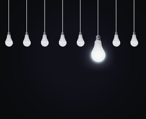 Poster - Hanging Bulbs in Line with One Glowing Big bulb Among All on the dark background. Concept Base Abstract Minimal dark backdrop with light one on the bulb