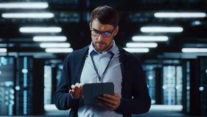 Fototapete - Successful Data Center IT Specialist Using Tablet Computer. Server Farm Cloud Computing Facility with System Administrator Working. Data Protection Engineering Network for Cyber Security.