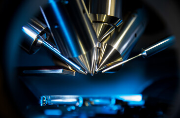 Time of flight mass spectrometer in closeup shot with blue light