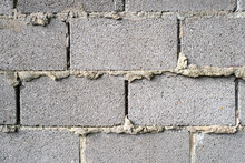 Abstract Of A Quickly Erected Block Wall Showing The Sloppy Cement Between The Bricks.