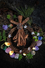 Wall Mural - witchcraft doll, candles, gemstones and leaves on dark natural forest background. Magic Crystal Ritual, Esoteric spiritual practice. Mysticism, divination, modern wicca concept. top view