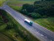 Gasoline truck Oil trailer on highway driving along the road. aerial view of Tank vehicle at work