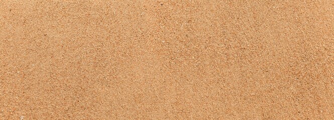 Panorama of Sand texture. Sandy beach for background. Top view. Natural sand stone texture background. sand on the beach as background. Wavy sand background for summer designs