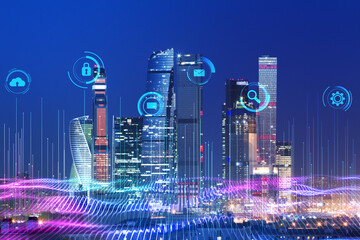 Smart city and digital transformation concept with digital glowing information and communication technologies signs on modern night city with skyscrapers background