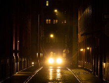 Headlights In Rainy Street