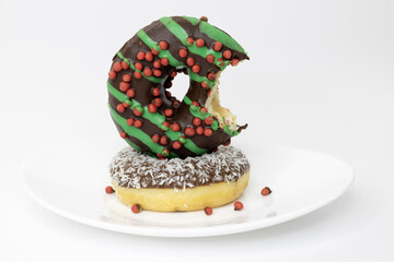 Sticker - A plate of donuts isolated on a white background