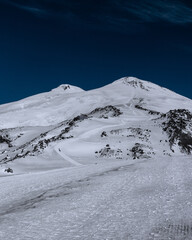 Wall Mural - Amazing snowy mountain landscape of the Caucasus, peaks of mount Elbrus on a clear blue sky day