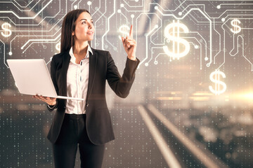 Aufkleber - Pretty happy european businesswoman holding laptop and pointing up in blurry office interior with abstract glowing money circuit and coding hologram. Cryptocurrency and finance concept. 
