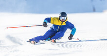 A Young Aggressive Skier On An Alpine Slope Demonstrates An Extreme Carving Skiing Style.