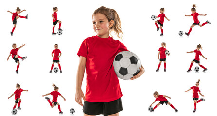 portraits of little girl, child, training, playing football isolated over white studio background. c