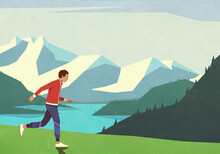 Carefree Man Jogging In Idyllic Mountain Field
