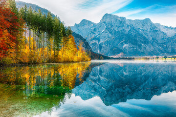 Wall Mural - amazing autumn scene of sunny morning on almsee lake.