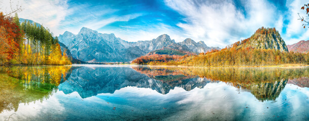 Wall Mural - picturesque autumn scene of sunny morning on almsee lake. poppular travell destination.