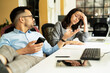 © JustLife - Colleagues arguing in office. Angry businesswpman yelling at her collegue..
