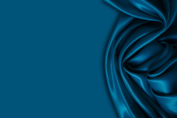 beautiful elegant wavy dark blue satin silk luxury cloth fabric with monochrome background design. c