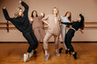 © Кирилл Горшков - Group of girls in sportswear, performing elements of house dance in a dance studio, dancing with pleasure. The concept of sports youth