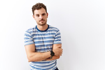 Canvas Print - Handsome young man standing over isolated background looking sleepy and tired, exhausted for fatigue and hangover, lazy eyes in the morning.