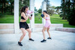 © luisrojasstock - a pair of two young women practicing fitness and boxing