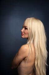  Portrait of beautiful young woman with long curly blonde hair 