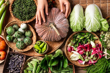 Fresh organic Southeast Asian vegetables and edible flowers from local farmer market, Northern of Thailand, Sustainability concept