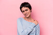 © Asier - Young caucasian woman isolated on pink background having a shoulder pain.