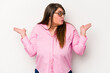 Young caucasian overweight woman isolated on white background confused and doubtful shrugging shoulders to hold a copy space.