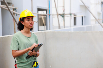 Professional black femal engineers and inspectors investigating the neatness of houses under construction in housing projects.