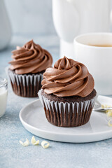 Dark chocolate cupcakes with whipped ganache frosting