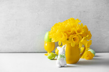 Easter Eggs, Bunny And Bouquet Of Yellow Daffodils In A Yellow Jug On Table Top, Easter Composition, Home Decor, Interior,